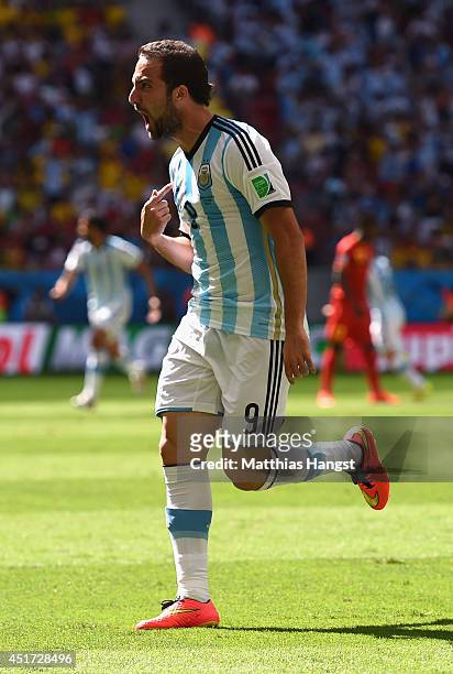 Gonzalo Higuain of Argentina celebrates scoring his team's first goal during the 2014 FIFA World Cup Brazil Quarter Final match between Argentina and...