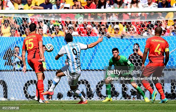 Gonzalo Higuain of Argentina scores his team's first goal during the 2014 FIFA World Cup Brazil Quarter Final match between Argentina and Belgium at...