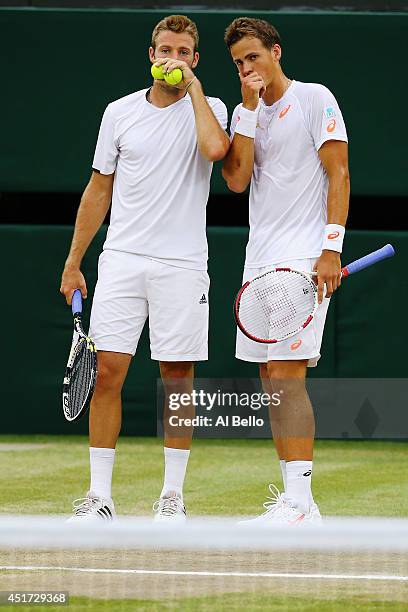 Jack Sock of the United States and Vasek Pospisil of Canada during their Gentlemen's Doubles Final against Bob Bryan and Mike Bryan of the United...