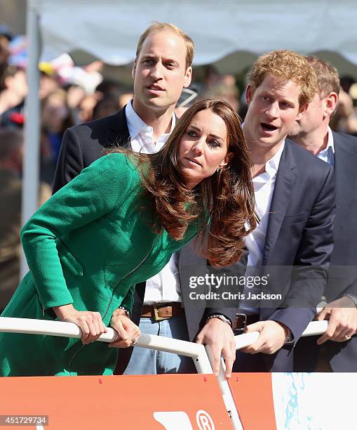 Catherine, Duchess of Cambridge, Prince William, Duke of Cambridge and Prince Harry watch as Mark Cavendish falls from his bike near the finish line...