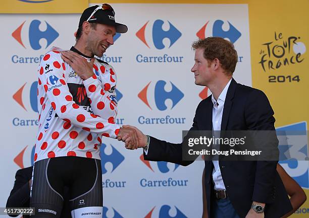 Jens Voigt of Germany and Trek Factory Racing takes the podium and is awarded the king of the mountains polka dot hersey by Prince Harry after stage...