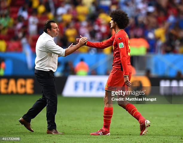 Head coach Marc Wilmots and Marouane Fellaini of Belgium shake hands after a 1-0 defeat to Argentina in the 2014 FIFA World Cup Brazil Quarter Final...