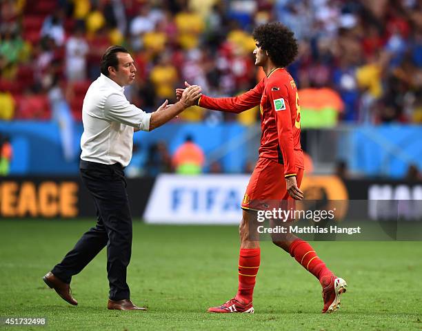 Head coach Marc Wilmots and Marouane Fellaini of Belgium shake hands after a 1-0 defeat to Argentina in the 2014 FIFA World Cup Brazil Quarter Final...