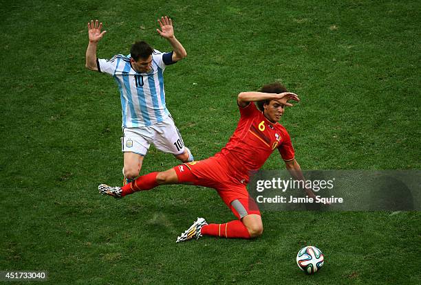 Lionel Messi of Argentina and Axel Witsel of Belgium clash during the 2014 FIFA World Cup Brazil Quarter Final match between Argentina and Belgium at...