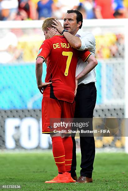 Kevin De Bruyne of Belgium is consoled by head coach Marc Wilmots of Belgium after the 0-1 defeat in the 2014 FIFA World Cup Brazil Quarter Final...