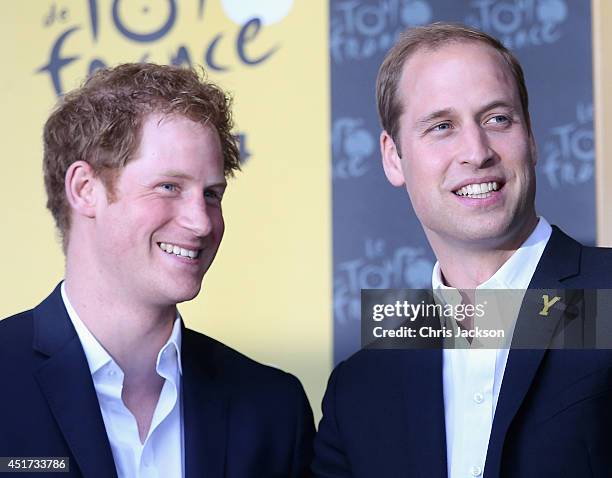 Prince Harry and Prince William, Duke of Cambridge laugh together on the podium after Stage 1 of the Tour De France on July 5, 2014 in Harrogate,...