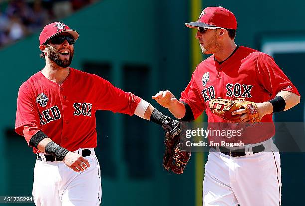 Dustin Pedroia and Stephen Drew of the Boston Red Sox react after they turned a double play against the Baltimore Orioles in the eighth inning during...