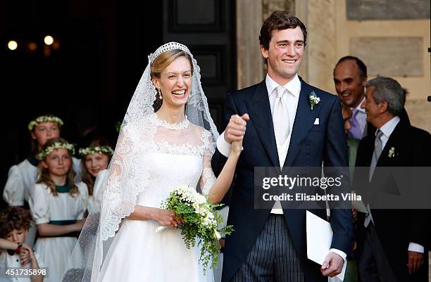 Prince Amedeo of Belgium and Princess Elisabetta Maria celebrate after their wedding ceremony at Basilica Santa Maria in Trastevere on July 5, 2014...