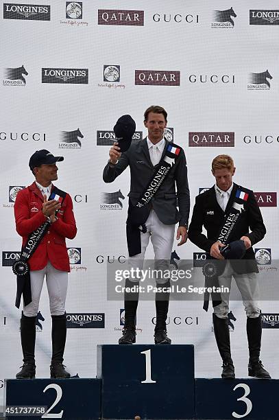 Winners of the 'Longines Global Champions Tour Grand Prix of Paris Competition', Pius Schwizer, Kevin Staut and Marcus Ehning pose during the Paris...