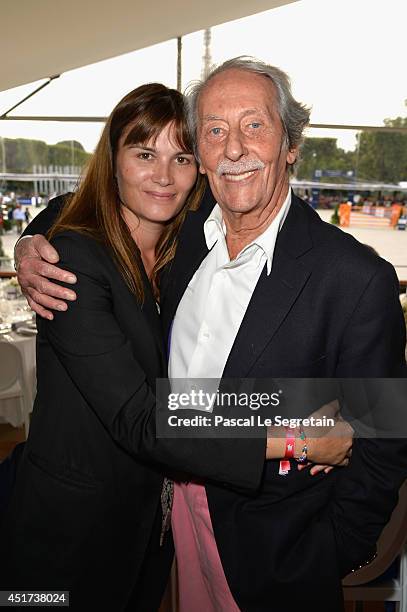 Marina Hands and Jean Rochefort attend the Paris Eiffel Jumping presented by Gucci at Champ-de-Mars on July 5, 2014 in Paris, France.