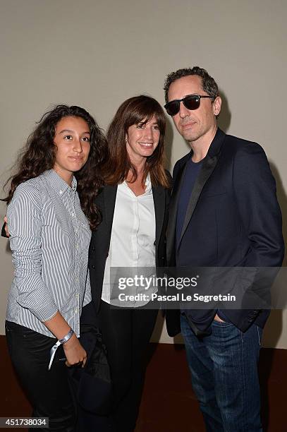 Albane Cleret , her daughter and Gad Elmaleh attend the Paris Eiffel Jumping presented by Gucci at Champ-de-Mars on July 5, 2014 in Paris, France.