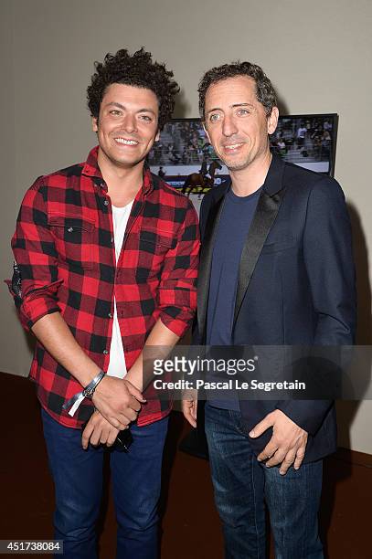 Kev Adams and Gad Elmaleh attend the Paris Eiffel Jumping presented by Gucci at Champ-de-Mars on July 5, 2014 in Paris, France.