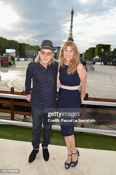 Elliott Murphy and his companion attend the Paris Eiffel Jumping presented by Gucci at Champ-de-Mars on July 5, 2014 in Paris, France.