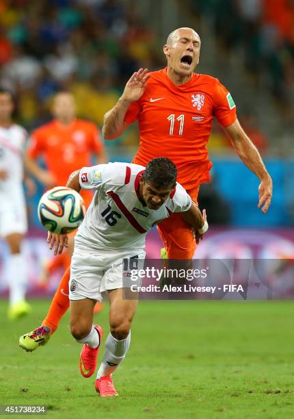 Cristian Gamboa of Costa Rica and Arjen Robben of the Netherlands compete for the ball during the 2014 FIFA World Cup Brazil Quarter Final match...