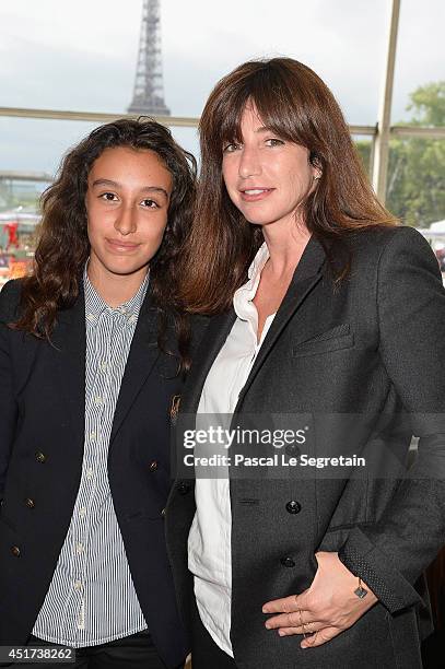 Albane Cleret and her daughter attend the Paris Eiffel Jumping presented by Gucci at Champ-de-Mars on July 5, 2014 in Paris, France.