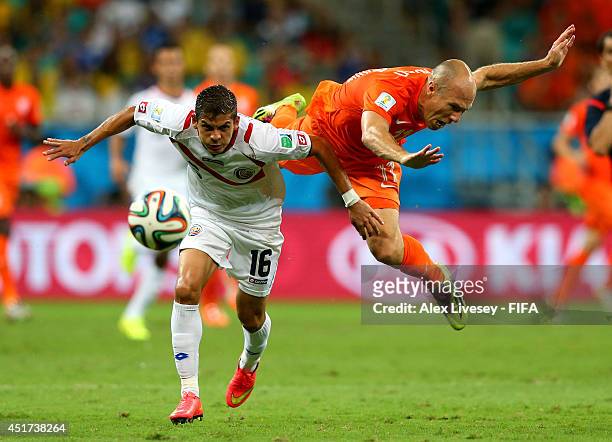 Cristian Gamboa of Costa Rica and Arjen Robben of the Netherlands compete for the ball during the 2014 FIFA World Cup Brazil Quarter Final match...