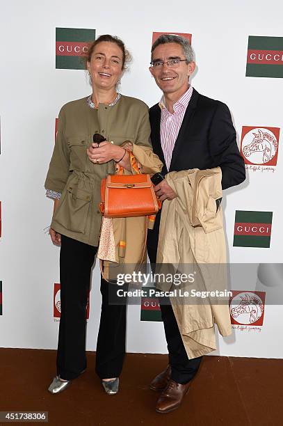 Of France Galop Thierry Delegue and his wife attend the Paris Eiffel Jumping presented by Gucci at Champ-de-Mars on July 5, 2014 in Paris, France.