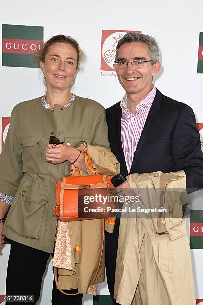 Of France Galop Thierry Delegue and his wife attend the Paris Eiffel Jumping presented by Gucci at Champ-de-Mars on July 5, 2014 in Paris, France.