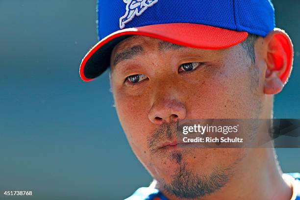 Daisuke Matsuzaka of the New York Mets observes the field during pre-game warmups before the start of their game against the Texas Rangers on July 5,...