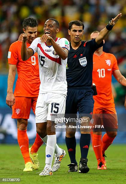 Referee Ravshan Irmatov gestures while Junior Diaz of Costa Rica appeals during the 2014 FIFA World Cup Brazil Quarter Final match between...