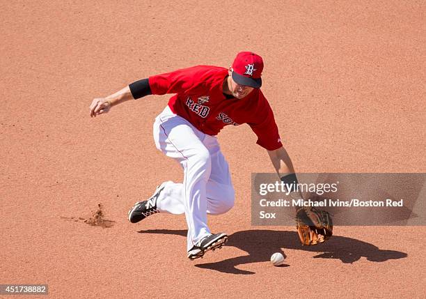 Stephen Drew of the Boston Red Sox fields a ground ball against the Baltimore Orioles in the eighth inning during the first game of a doubleheader at...