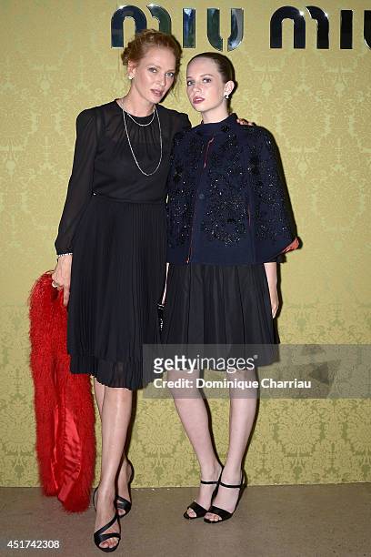 Uma Thurman and her daughter Maya Hawke attend the Miu Miu Resort Collection 2015 at Palais d'Iena on July 5, 2014 in Paris, France.