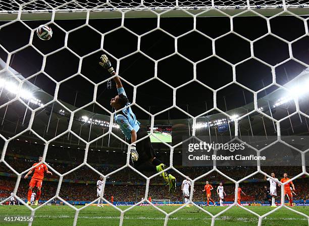 Wesley Sneijder of the Netherlands attempts a shot at goal against Keylor Navas of Costa Rica and hits the crossbar during the 2014 FIFA World Cup...