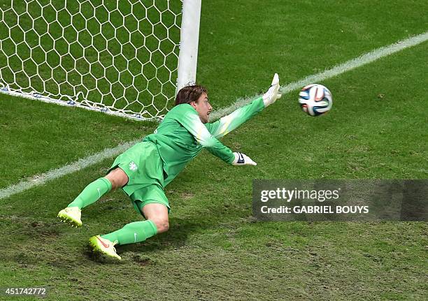 Netherlands' goalkeeper Tim Krul saves a penalty by Costa Rica's defender Michael Umana during the penalty shout out of a quarter-final football...