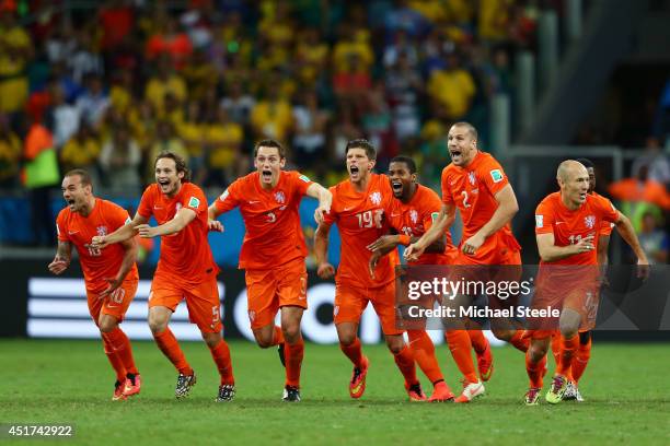 Wesley Sneijder, Daley Blind, Stefan de Vrij, Klaas-Jan Huntelaar, Jeremain Lens, Ron Vlaar and Arjen Robben of the Netherlands celebrate victory in...