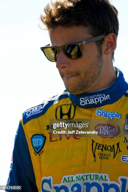 Marco Andretti driver of the Snapple Honda stands on the grid during qualifying for the Pocono INDYCAR 500 at Pocono Raceway on July 5, 2014 in Long...