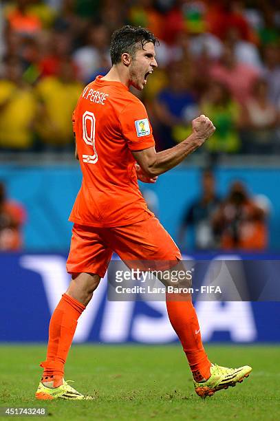 Robin van Persie of the Netherlands celebrates scoring in the penalty shootout during the 2014 FIFA World Cup Brazil Quarter Final match between...