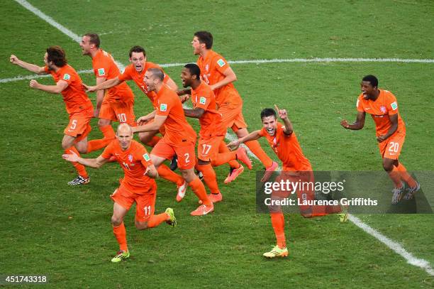The Netherlands celebrate after defeating Costa Rica in a penalty shootout during the 2014 FIFA World Cup Brazil Quarter Final match between the...