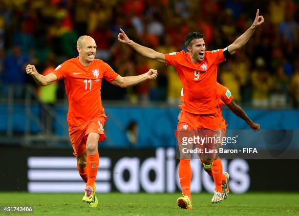 Arjen Robben and Robin van Persie of the Netherlands celebrate the win after the penalty shootout in the 2014 FIFA World Cup Brazil Quarter Final...