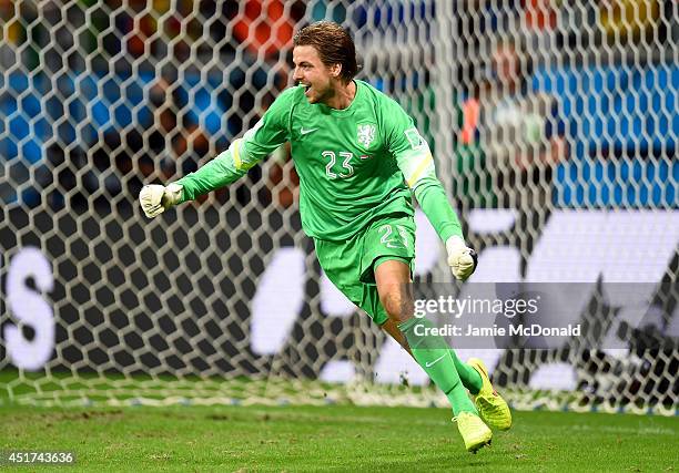 Goalkeeper Tim Krul of the Netherlands celebrates after making a save on a penalty kick by Michael Umana of Costa Rica to defeat Costa Rica in a...