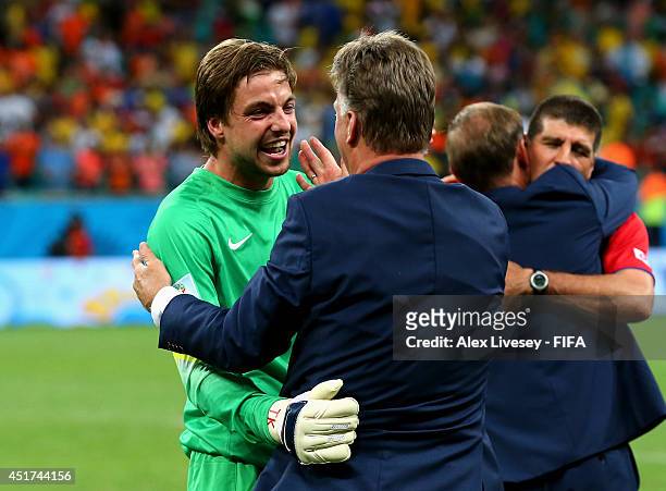Tim Krul of the Netherlands celebrates the win with head coach Louis van Gaal after the 2014 FIFA World Cup Brazil Quarter Final match between...
