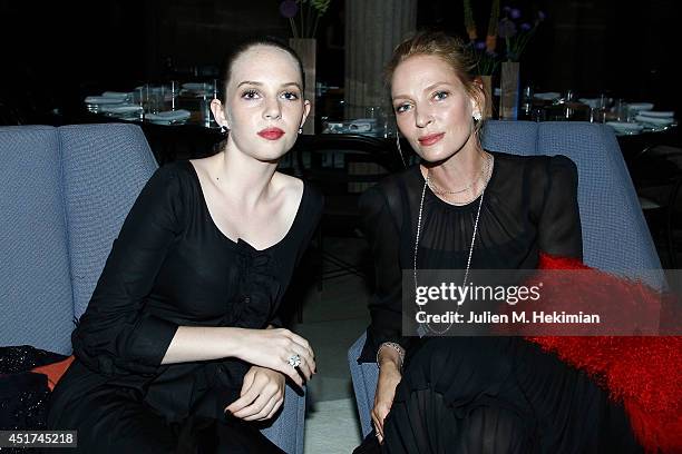 Uma Thurman and Maya Hawke attend the Miu Miu Resort Collection 2015 at Palais d'Iena on July 5, 2014 in Paris, France.