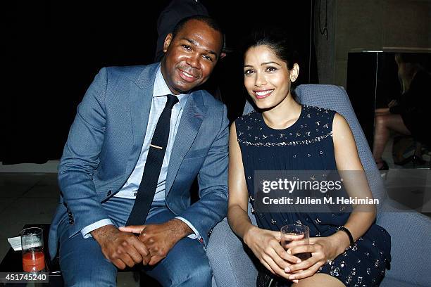 Freida Pinto and guest attend the Miu Miu Resort Collection 2015 at Palais d'Iena on July 5, 2014 in Paris, France.