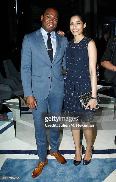 Freida Pinto and guest attend the Miu Miu Resort Collection 2015 at Palais d'Iena on July 5, 2014 in Paris, France.