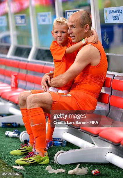 Arjen Robben of the Netherlands celebrates the win with his son Luka after the 2014 FIFA World Cup Brazil Quarter Final match between Netherlands and...