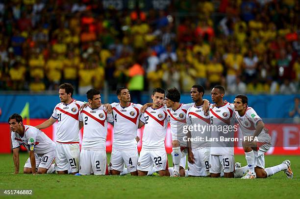 Costa Rica players watch in a penalty shootout during the 2014 FIFA World Cup Brazil Quarter Final match between Netherlands and Costa Rica at Arena...
