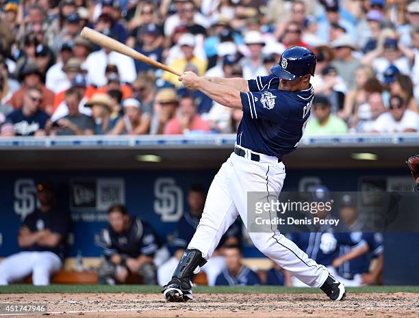 Brooks Conrad of the San Diego Padres hits a single during the sixth inning of a baseball game against the San Francisco Giants at Petco Park July 5,...
