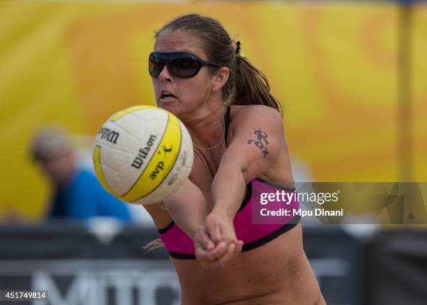 Brooke Sweat digs the ball during her match at the AVP Milwaukee Open on July 5, 2014 at Bradford Beach in St in Milwaukee, Wisconsin.