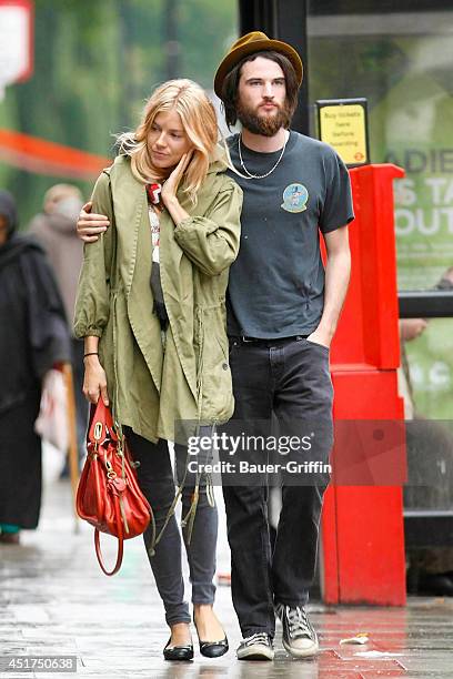 Sienna Miller with her boyfriend Tom Sturridge are seen on August 23, 2011 in London, United Kingdom.