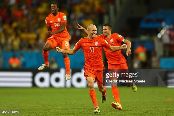 Georginio Wijnaldum , Arjen Robben and Robin van Persie of the Netherlands lead the celebrations after defeating Costa Rica in a penalty shootout of...