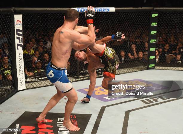 Lyoto Machida kicks UFC middleweight champion Chris Weidman in their UFC middleweight championship fight at UFC 175 inside the Mandalay Bay Events...