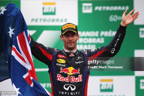 Mark Webber of Australia and Infiniti Red Bull Racing celebrates on the podium after finishing second in his final F1 race following the Brazilian...