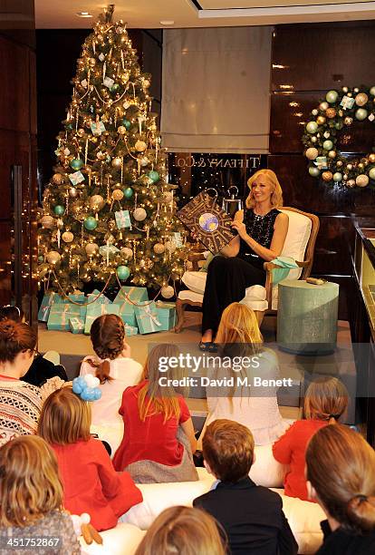 Joely Richardson reads to children as she officially opens the Tiffany & Co. Christmas Shop on Bond Street, London on November 24, 2013 in London,...