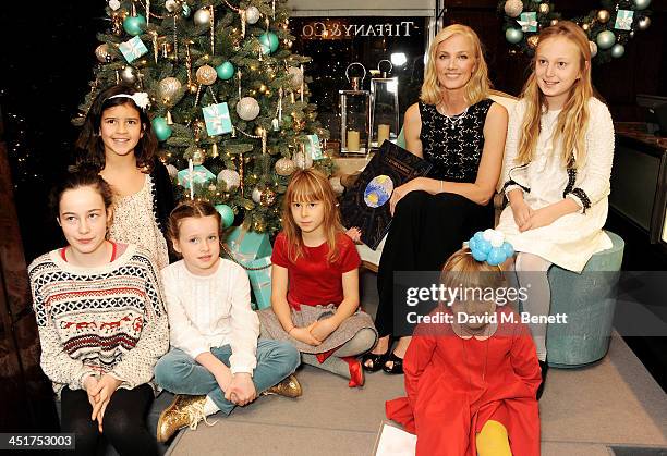 Joely Richardson poses with children as she officially opens the Tiffany & Co. Christmas Shop on Bond Street, London on November 24, 2013 in London,...