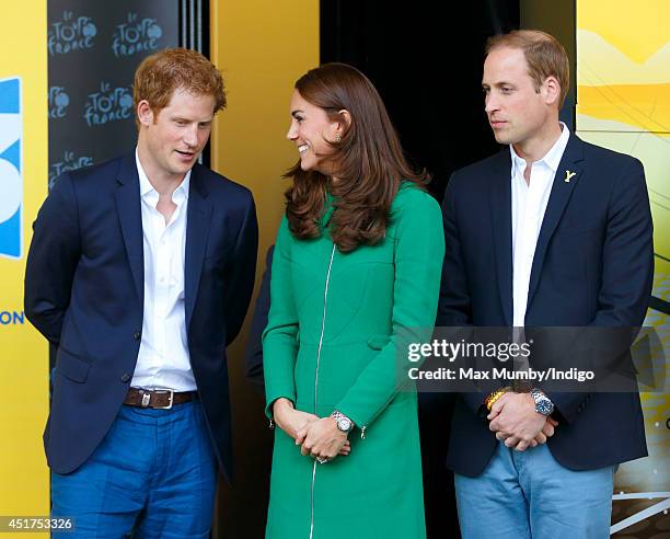 Prince Harry, Catherine, Duchess of Cambridge and Prince William, Duke of Cambridge stand on the podium at the finish of stage one of the Tour de...