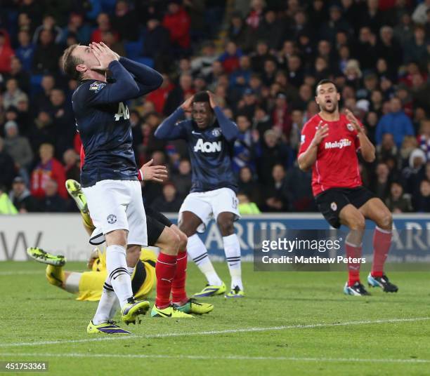 Wayne Rooney of Manchester United reacts to missing a chance during the Barclays Premier League match between Cardiff City and Manchester United at...